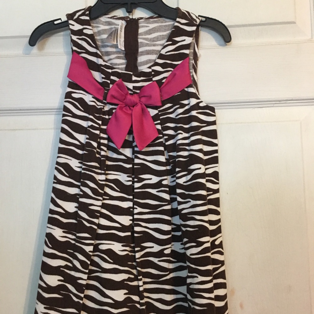 Brown and white zebra design with pink ribbon